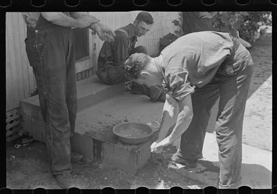 Washing up for dinner during wheat harvest, central Ohio, 1938