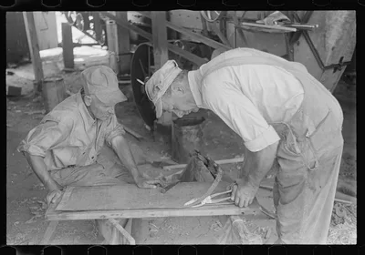 Repairing the thresher, central Ohio, 1938