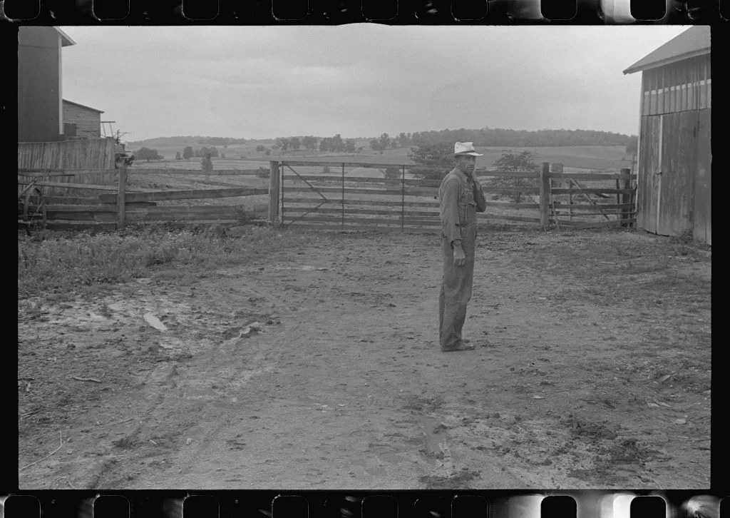 Virgil Thaxton, farmer, in barnyard of Thaxton farm, near…, Ohio, 1938