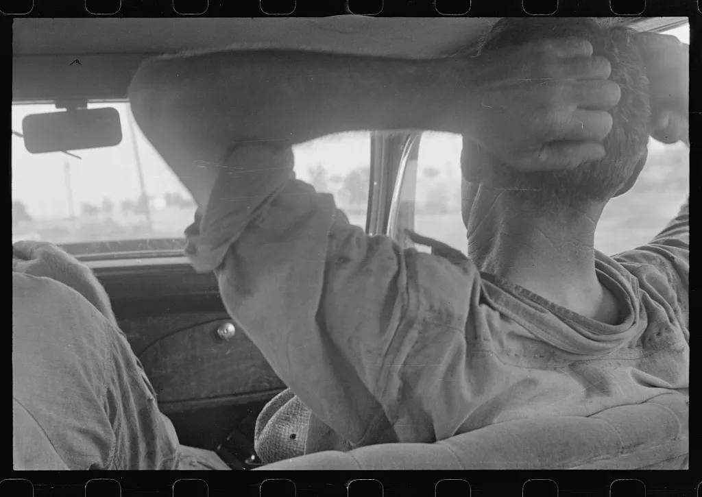 Ohio farmer resting in car, central Ohio, 1938
