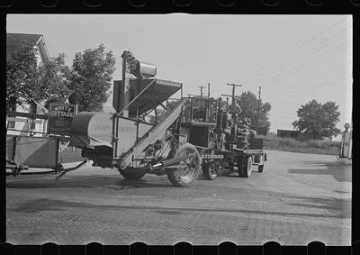[Untitled photo, possibly related to: Moving combine and tractor,…, Ohio, 1938