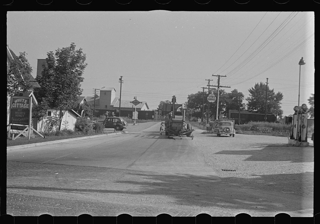 [Untitled photo, possibly related to: Cars parked beside feed store,…, Ohio, 1938