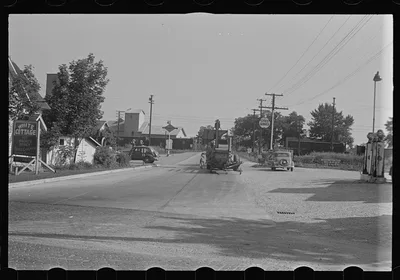 [Untitled photo, possibly related to: Cars parked beside feed store,…, Ohio, 1938