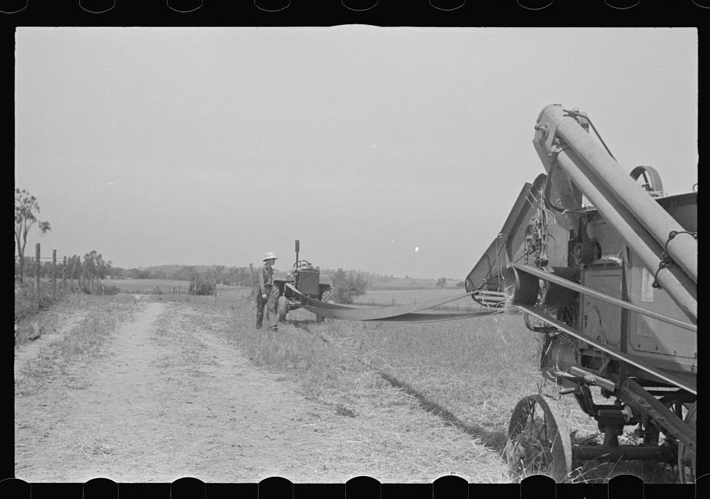 [Untitled photo, possibly related to: Loading hay from window with…, Ohio, 1938