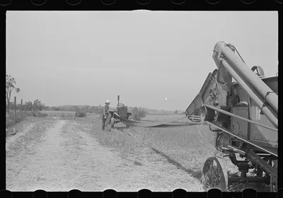 [Untitled photo, possibly related to: Loading hay from window with…, Ohio, 1938