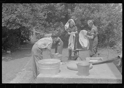 Washing up before dinner during wheat harvest, central Ohio, 1938