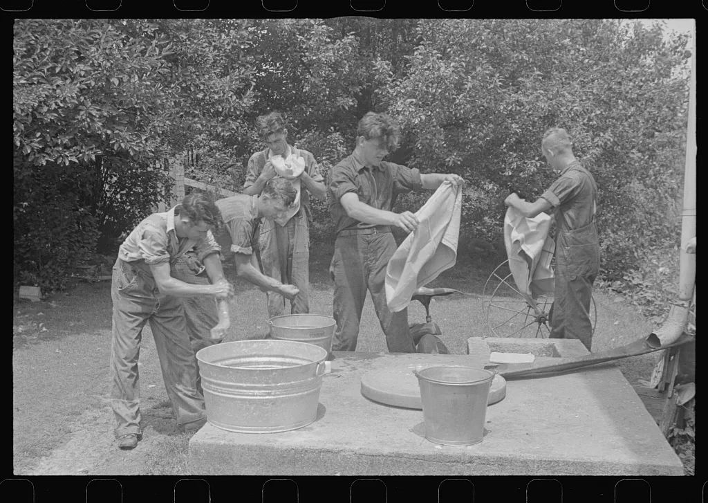 Washing up before dinner during wheat harvest, Central Ohio, 1938