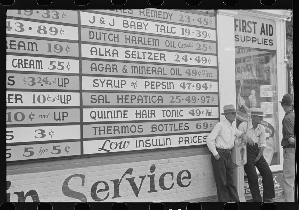 Sign on drugstore, Newark, Ohio, 1938