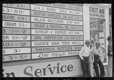 Sign on drugstore, Newark, Ohio, 1938