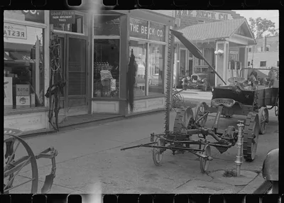 Farm implements outside store, Canal Winchester, Ohio, 1938