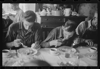 Threshing hands eating dinner, wheat harvest time, central Ohio, 1938