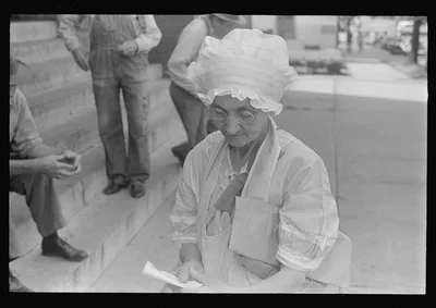 Woman outside relief station, Urbana, Ohio, 1938