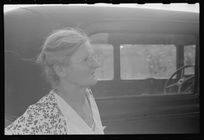Farmer's wife watching proceedings at farm auction, New Carlisle…, Ohio, 1938
