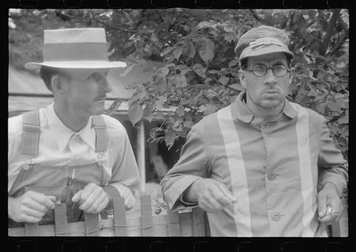 Spectator and clocker at county fair in central Ohio, 1938