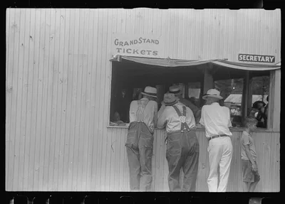 Purchasing tickets at county fair, central Ohio, 1938