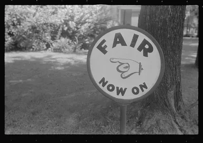 Sign advertising county fair, central Ohio, 1938