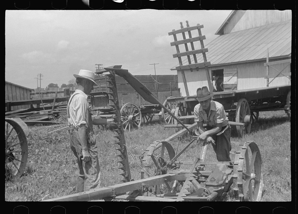Inspecting farm machinery at public auction in central Ohio, 1938