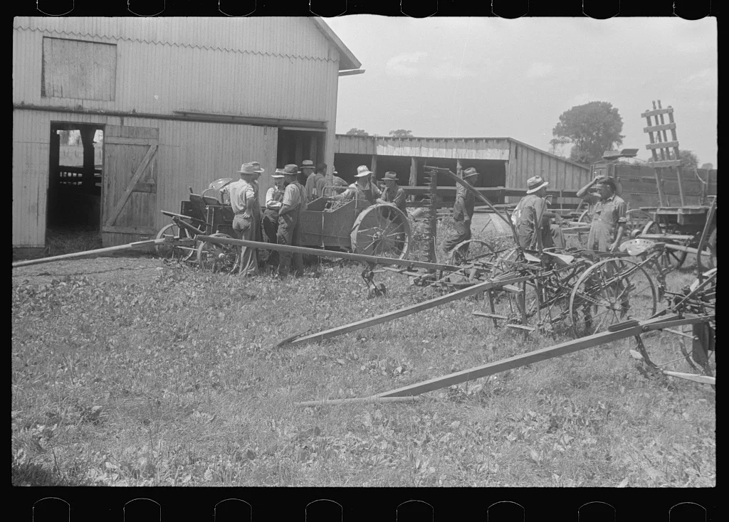 [Untitled photo, possibly related to: Inspecting farm machinery at…, Ohio, 1938
