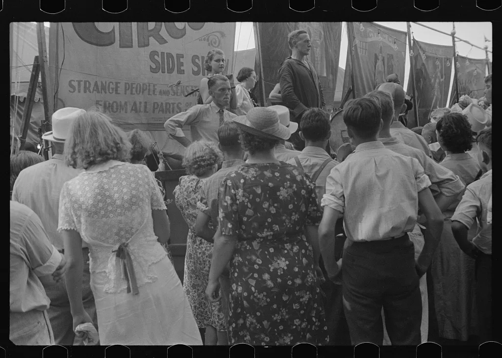 Spectators at sideshow, county fair, central Ohio, 1938