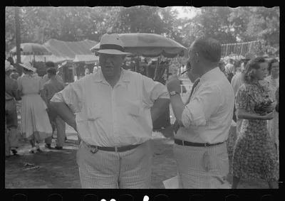 [Untitled photo, possibly related to: Spectators at sideshow, county…, Ohio, 1938